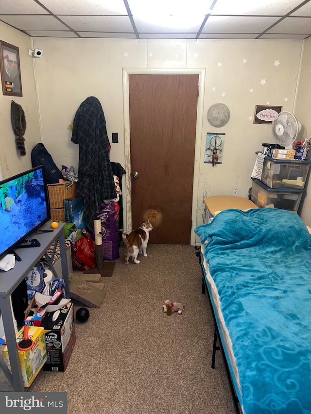 bedroom with carpet and a drop ceiling