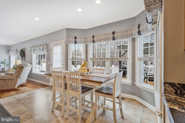 dining space featuring ornamental molding