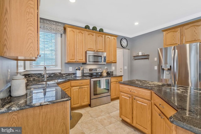 kitchen featuring sink, dark stone countertops, ornamental molding, light tile patterned floors, and stainless steel appliances