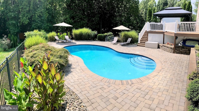 view of pool with a gazebo, a patio area, and a deck