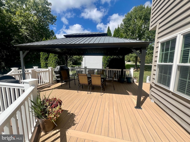 wooden deck featuring a gazebo and grilling area