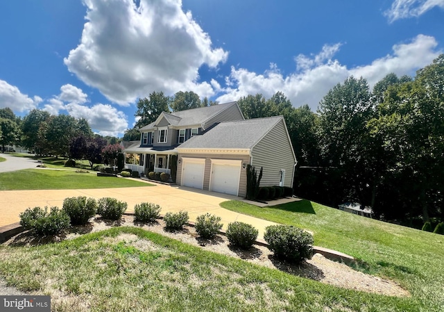 view of front of home with a garage and a front yard