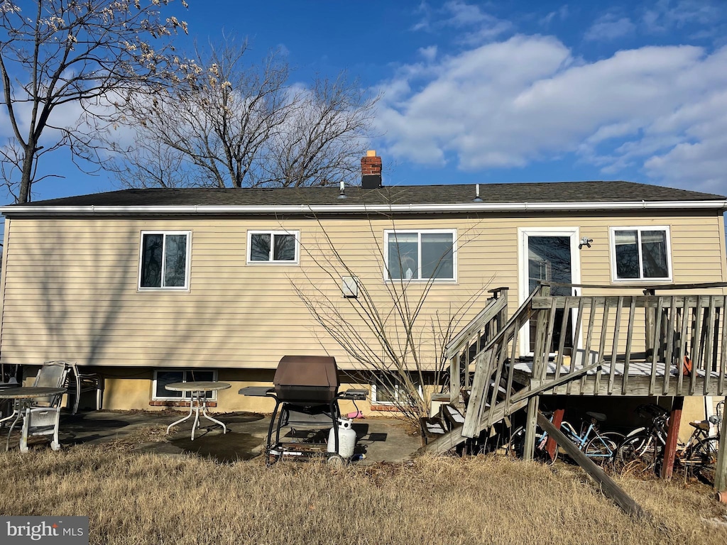 rear view of property with a deck