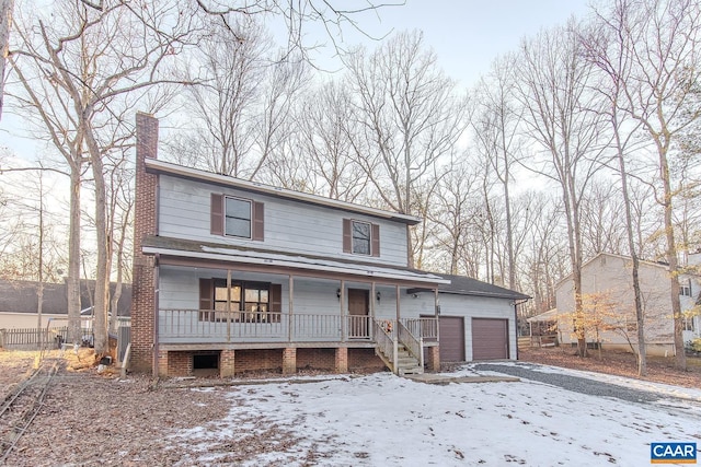 view of front of home featuring a garage and covered porch