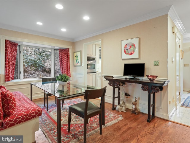 dining room featuring crown molding and hardwood / wood-style floors