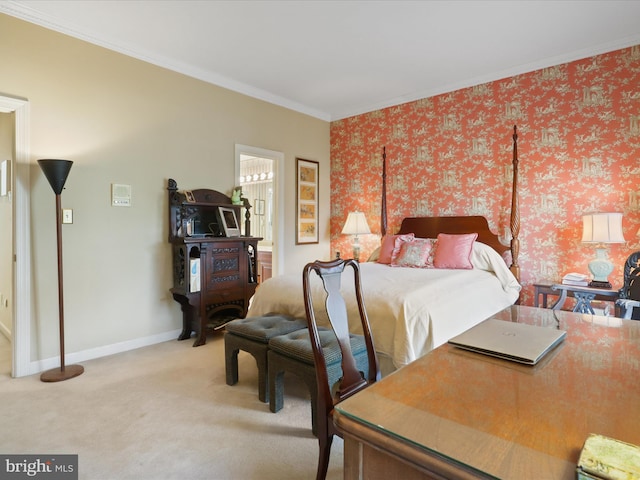 bedroom with crown molding, light colored carpet, and ensuite bath