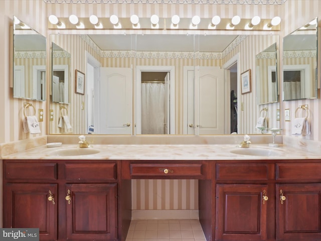 bathroom with vanity, tile patterned floors, and walk in shower