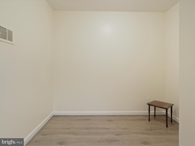 spare room featuring light wood-type flooring