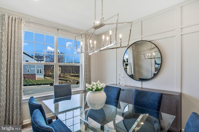 dining area featuring an inviting chandelier and a wealth of natural light