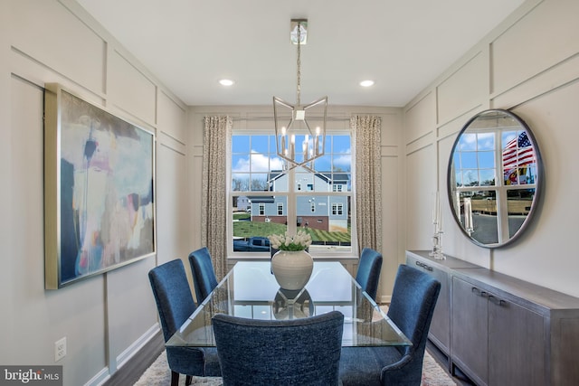 dining space with a chandelier