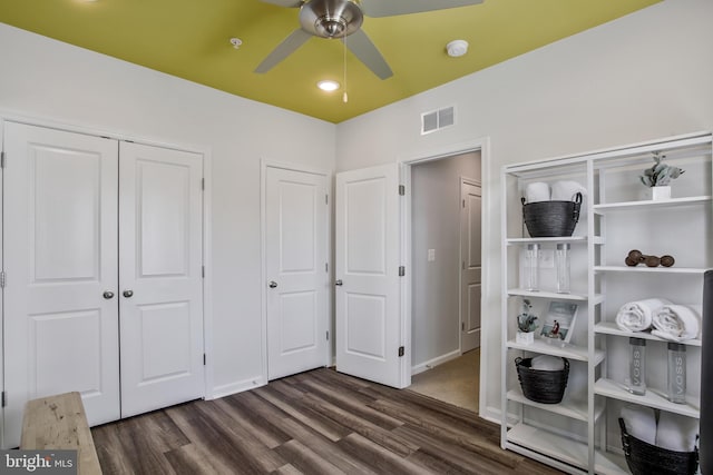 bedroom with dark wood-type flooring and ceiling fan