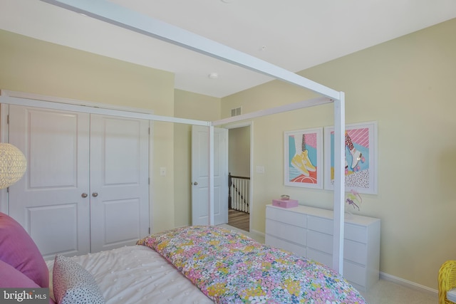 carpeted bedroom featuring a closet