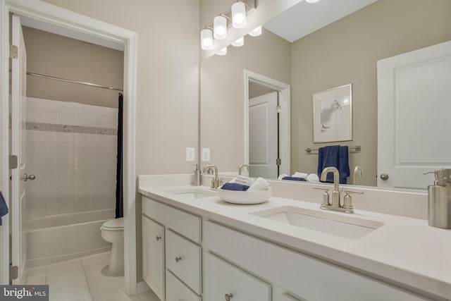 full bathroom with tile patterned floors, toilet, shower / bath combo with shower curtain, and vanity