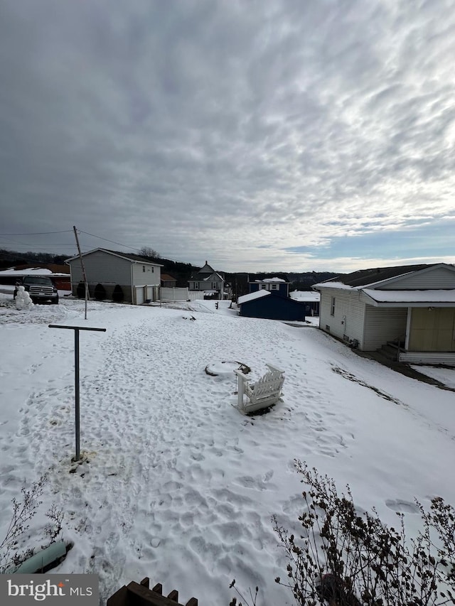 view of yard covered in snow