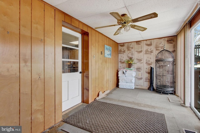 interior space featuring ceiling fan