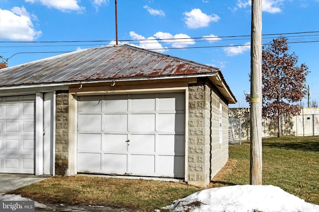 garage with a yard