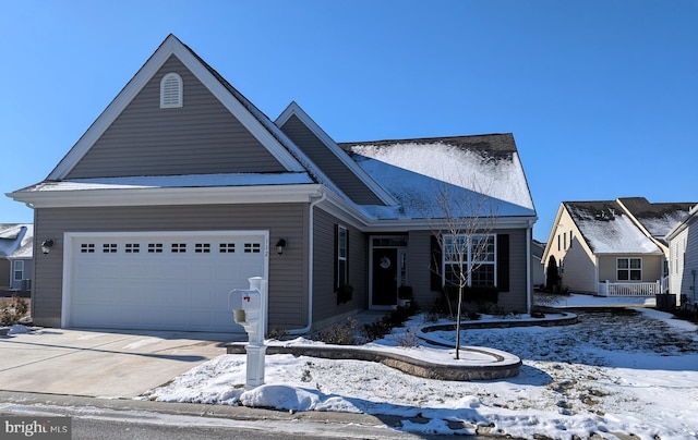 view of front of property featuring a garage and central AC