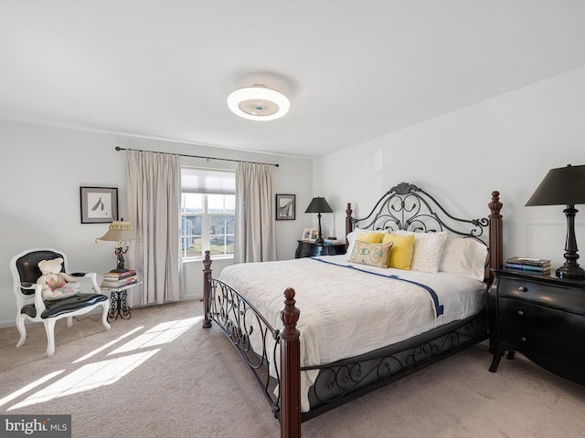 bedroom featuring light colored carpet