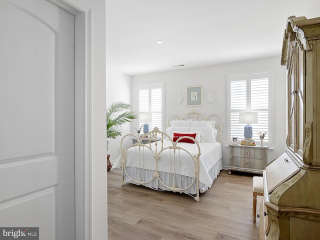 bedroom with light hardwood / wood-style flooring