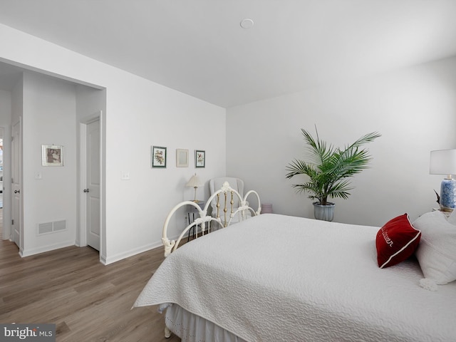 bedroom featuring light hardwood / wood-style floors