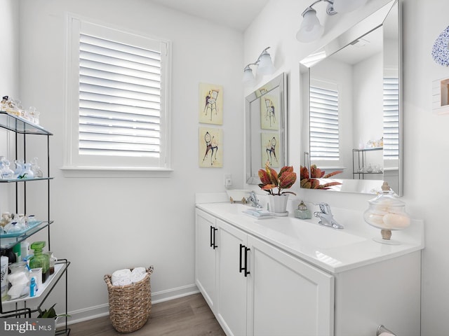 bathroom with vanity and wood-type flooring