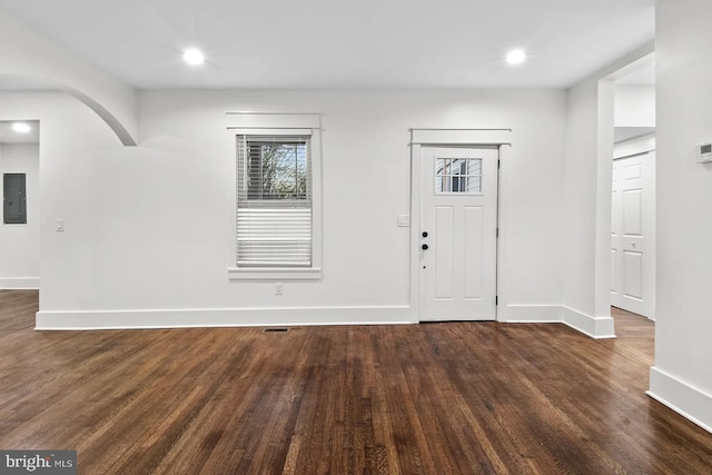 entryway featuring dark wood-type flooring and electric panel