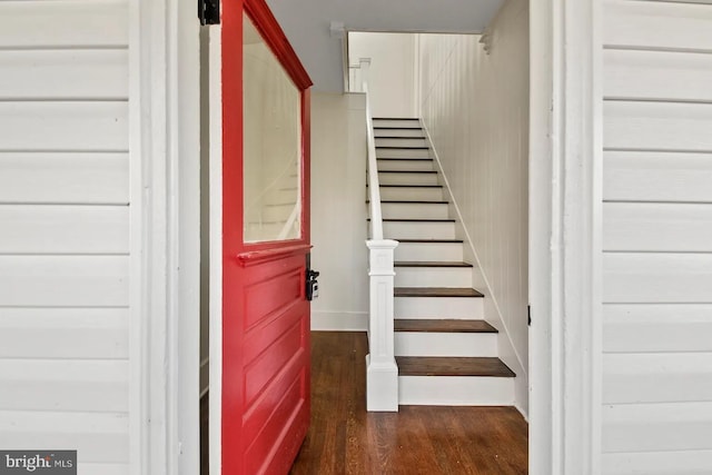 staircase featuring hardwood / wood-style flooring