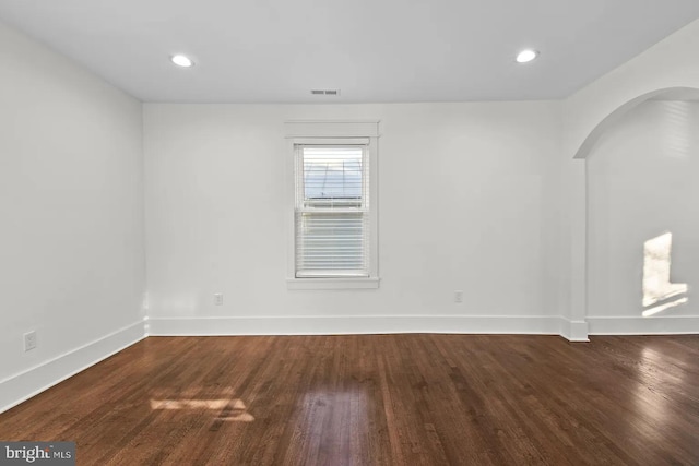 unfurnished room with hardwood / wood-style floors