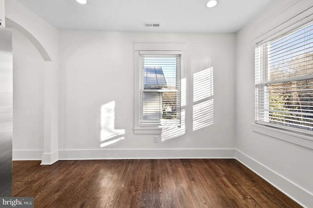 unfurnished room featuring dark hardwood / wood-style floors