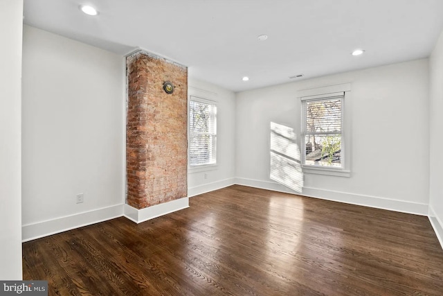 interior space featuring plenty of natural light and dark hardwood / wood-style floors