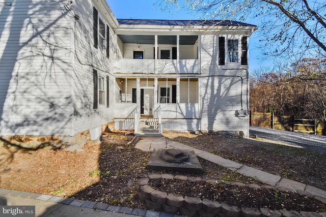 view of front of home with a balcony