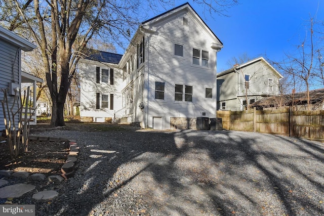 back of property with central air condition unit