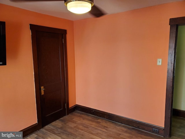 empty room featuring dark wood-type flooring