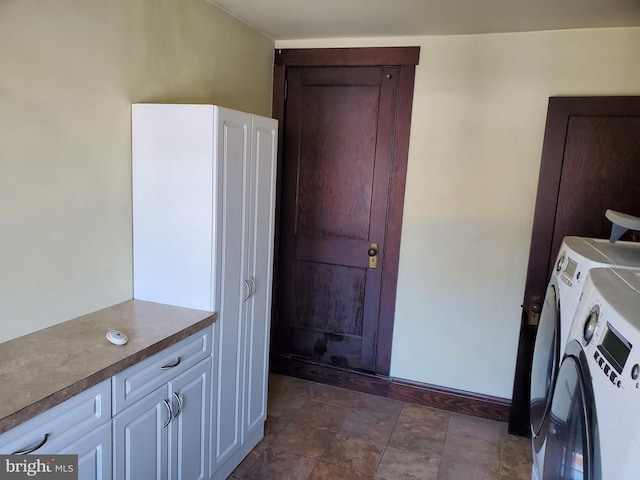 laundry area featuring cabinets and washing machine and dryer