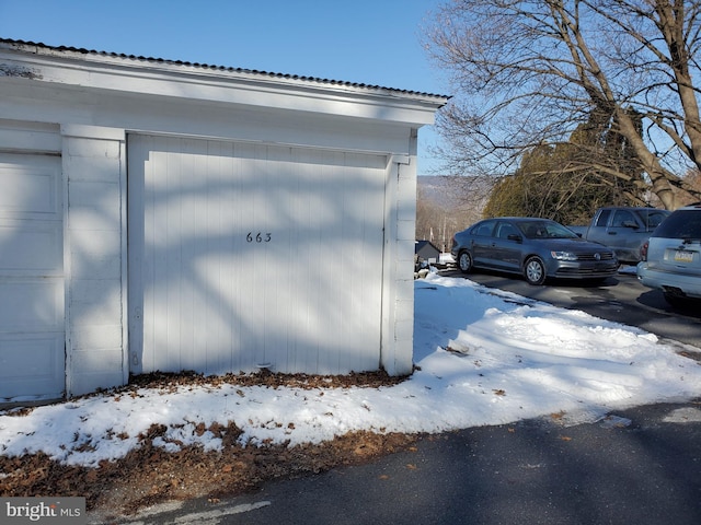 view of snow covered garage