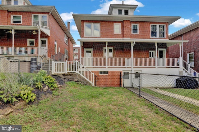 view of front of house with a porch and a front lawn