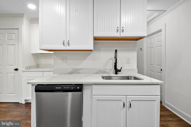 kitchen featuring ornamental molding, dishwasher, sink, and white cabinets