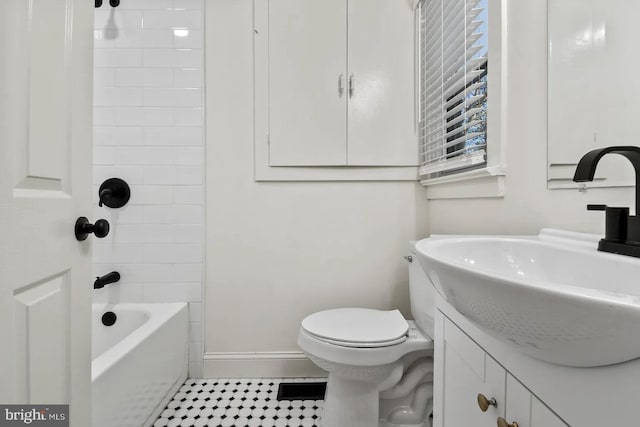 full bathroom featuring vanity, tub / shower combination, and toilet