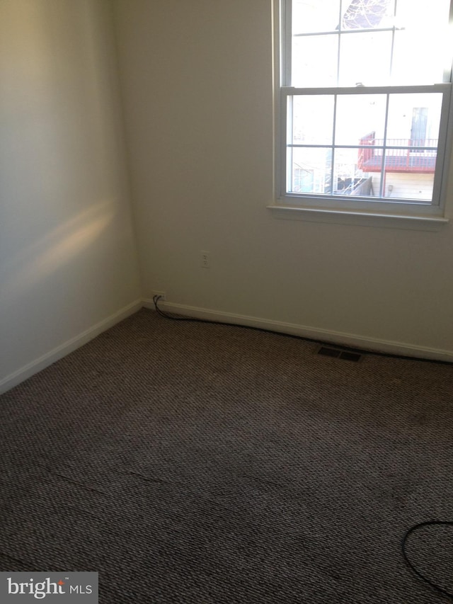 empty room featuring carpet floors