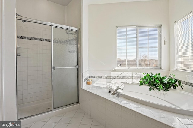 full bath with a garden tub, a stall shower, and tile patterned flooring