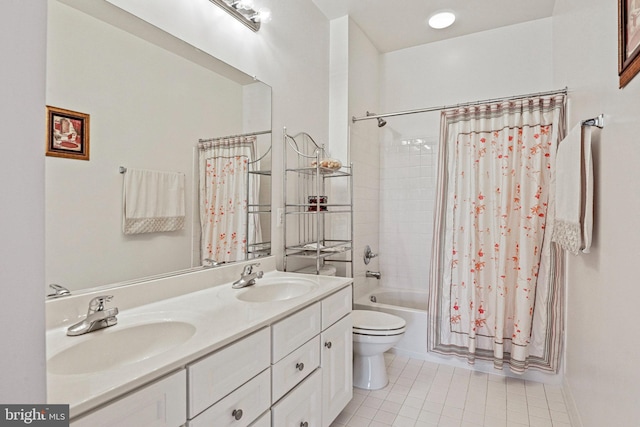 full bath with a sink, toilet, shower / bath combo, and double vanity