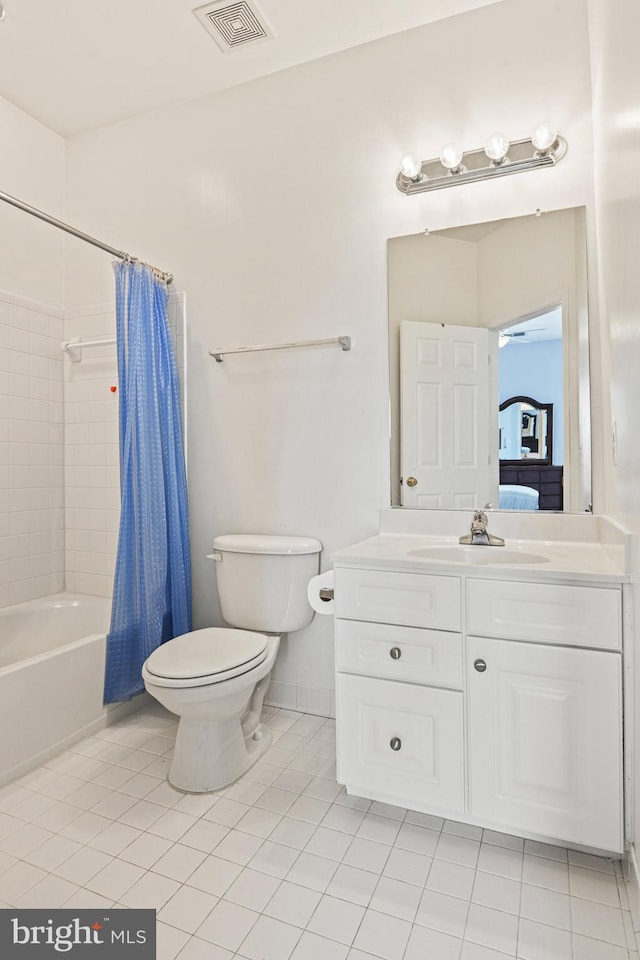 full bath with tile patterned floors, visible vents, shower / bath combo with shower curtain, toilet, and vanity