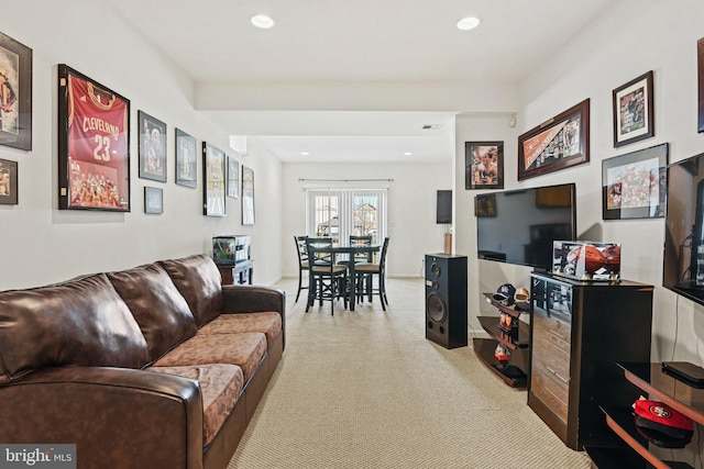 living room featuring recessed lighting and visible vents