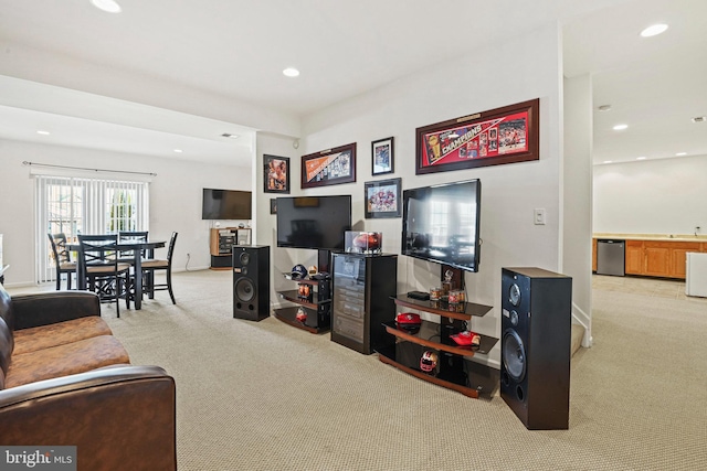 living room with recessed lighting, baseboards, and carpet flooring