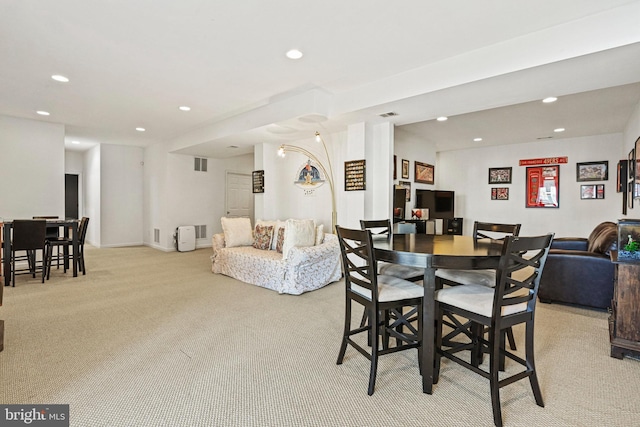 dining area with recessed lighting, visible vents, light carpet, and baseboards