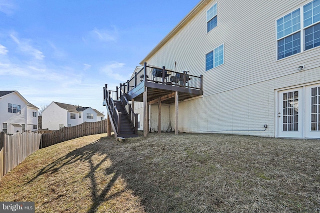 back of house with a deck, stairs, and fence