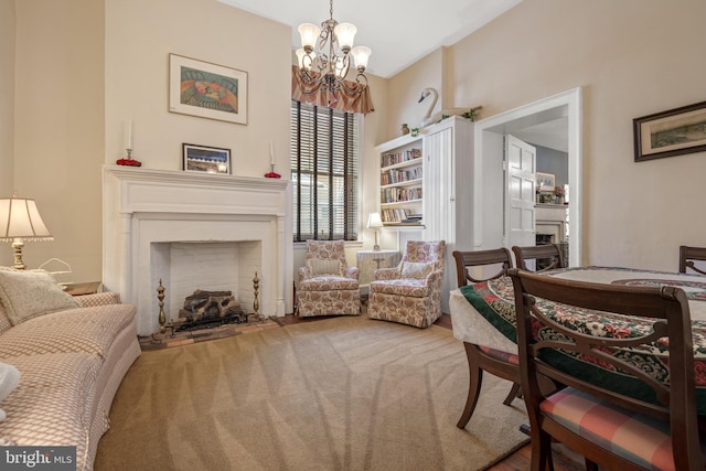 living room with an inviting chandelier and carpet