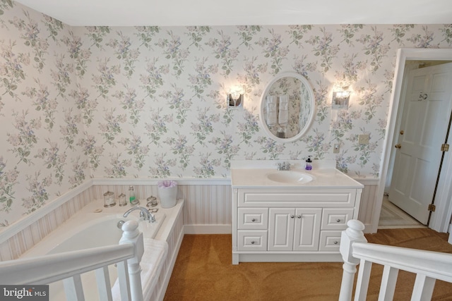 bathroom with vanity and a bath