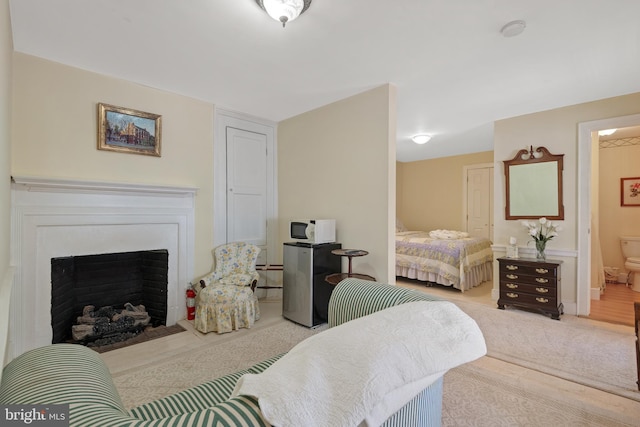 bedroom featuring ensuite bath