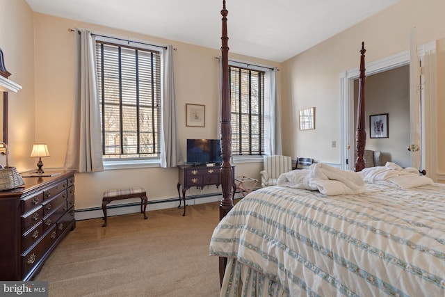 bedroom with a baseboard radiator and light colored carpet